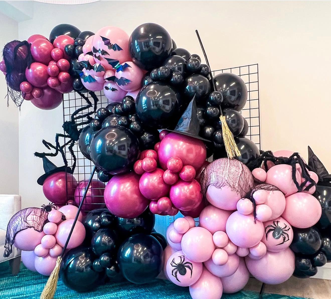 Pinkoween witch balloon wall installation in Miami